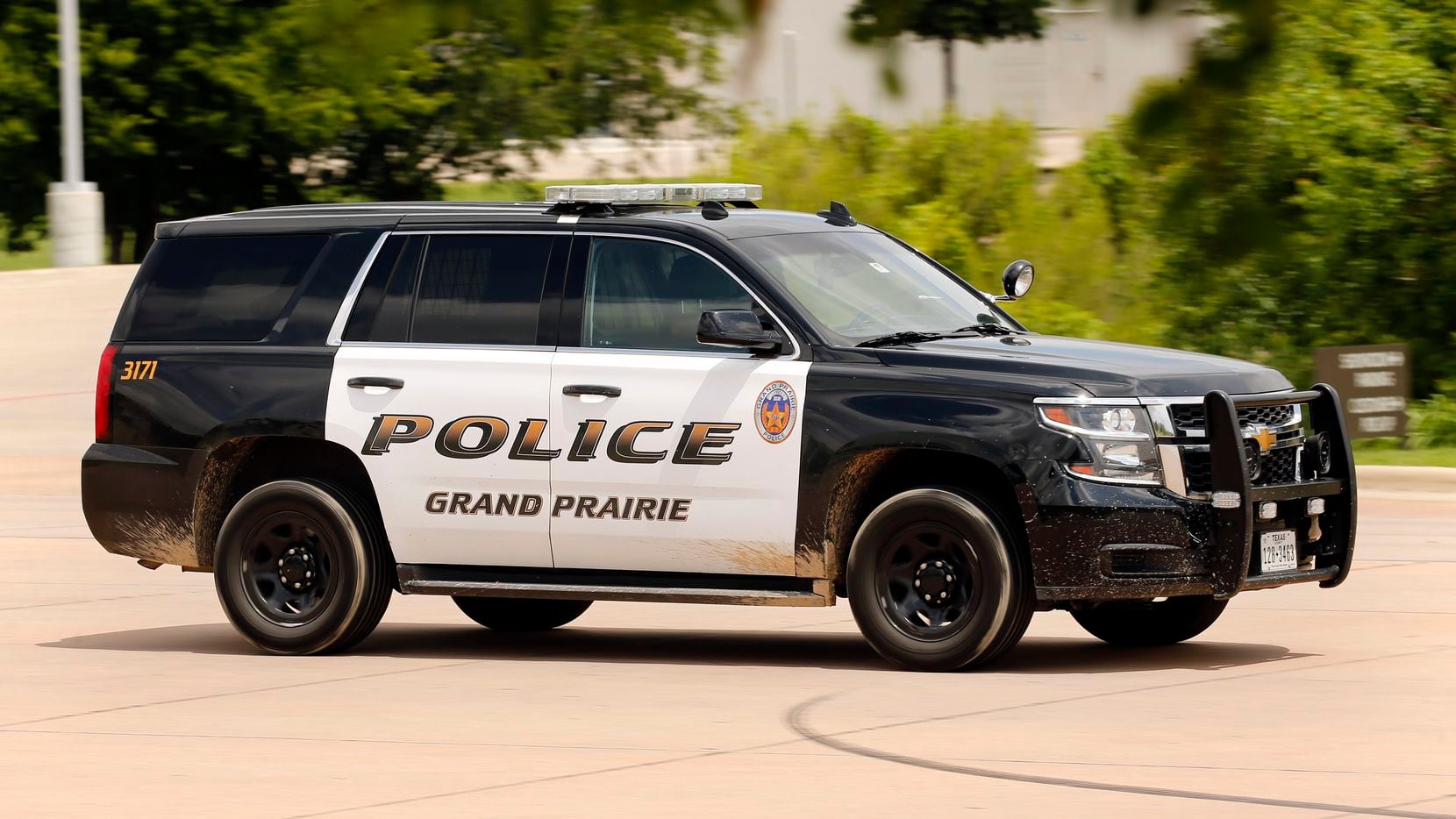 A Grand Prairie Police vehicle leaves the department in Grand Prairie, Texas, Thursday, June 25, 2020. (Tom Fox/The Dallas Morning News)
