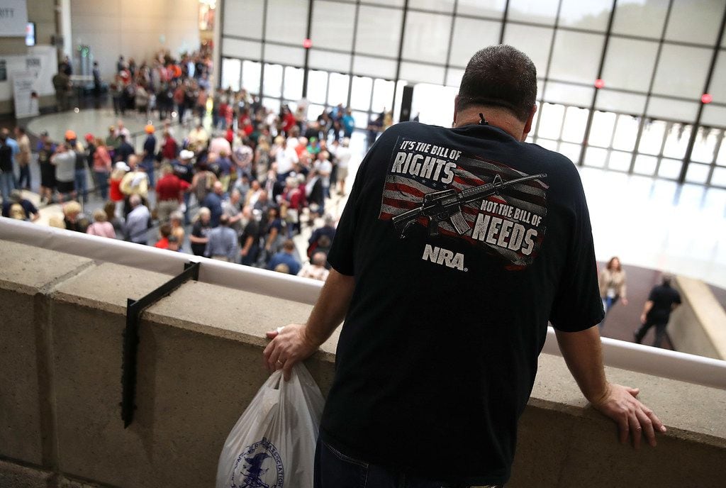 An attendee looks at a line to enter the NRA-ILA Leadership Forum during the NRA Annual...