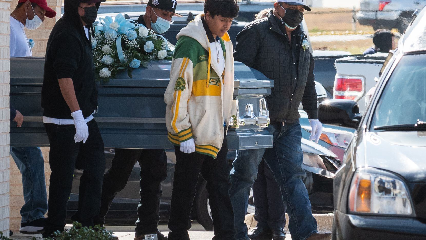 Pallbearers carried the casket of 16-year-old Ivan Noyola, 16, after his memorial service in...