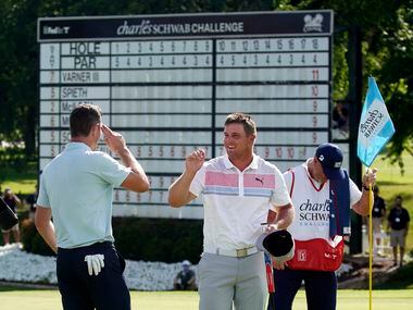 PGA Tour golfer Justin Rose salutes playing partner Bryson DeChambeau who gave him an air...