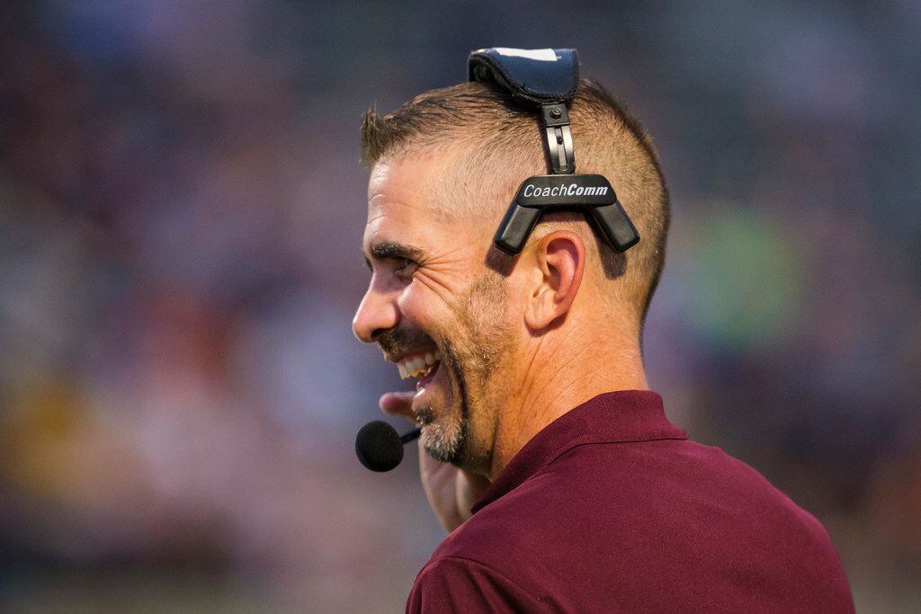 Mesquite head coach Jeff Fleener laughs on the sidelines during the first half of a high...