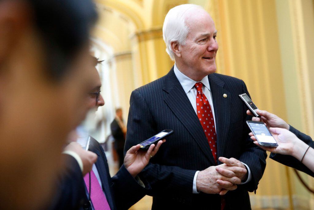 Senate Majority Whip John Cornyn of Texas, talks with reporters about President Trump's...