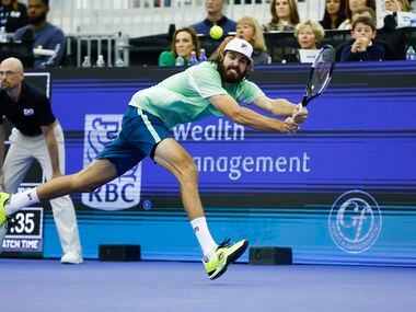 Reilly Opelka returns the ball during the finals ATP Dallas Open against Jenson Brooksby at...