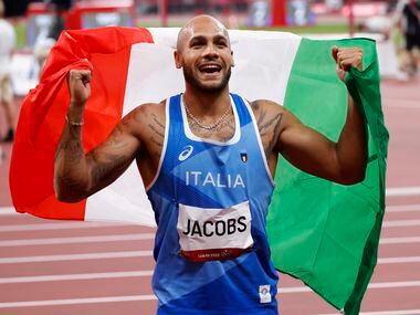 Italy’s Lamont Marcell Jacobs celebrates after competing in the men’s 100 meter final during...