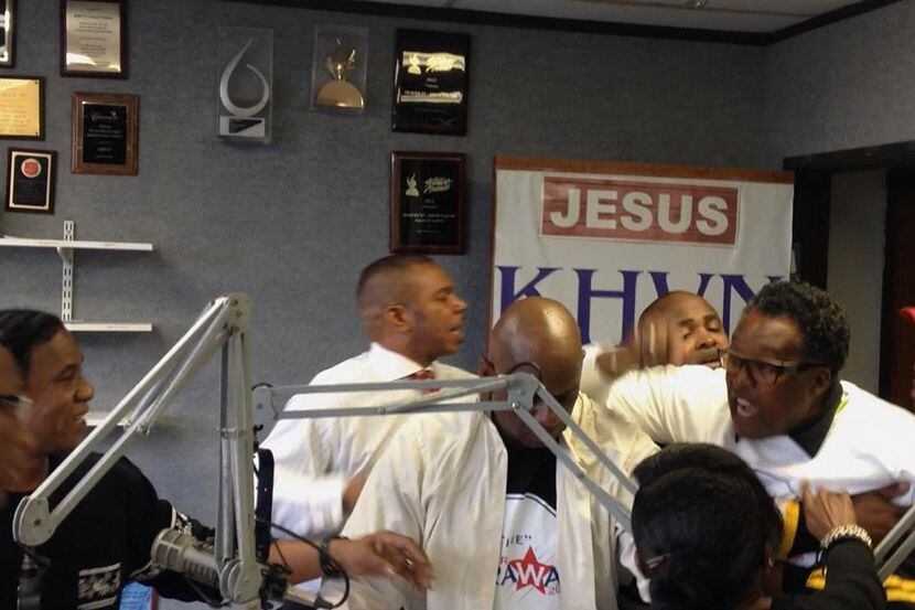 Two men are seen holding back Dwaine Caraway from John Wiley Price in a video of Mondays...