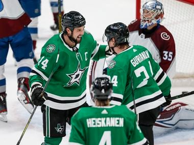 Dallas Stars forward Denis Gurianov (34) is congratulated by forward Jamie Benn (14) after scoring a goal during the second period of an NHL hockey game against the Colorado Avalanche in Dallas, Friday, November 26, 2021.