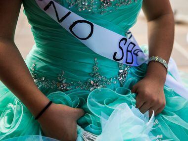 Jennifer Ramirez, 16, wears a "No SB4" sash as she and other teenage girls with Jolt Texas...