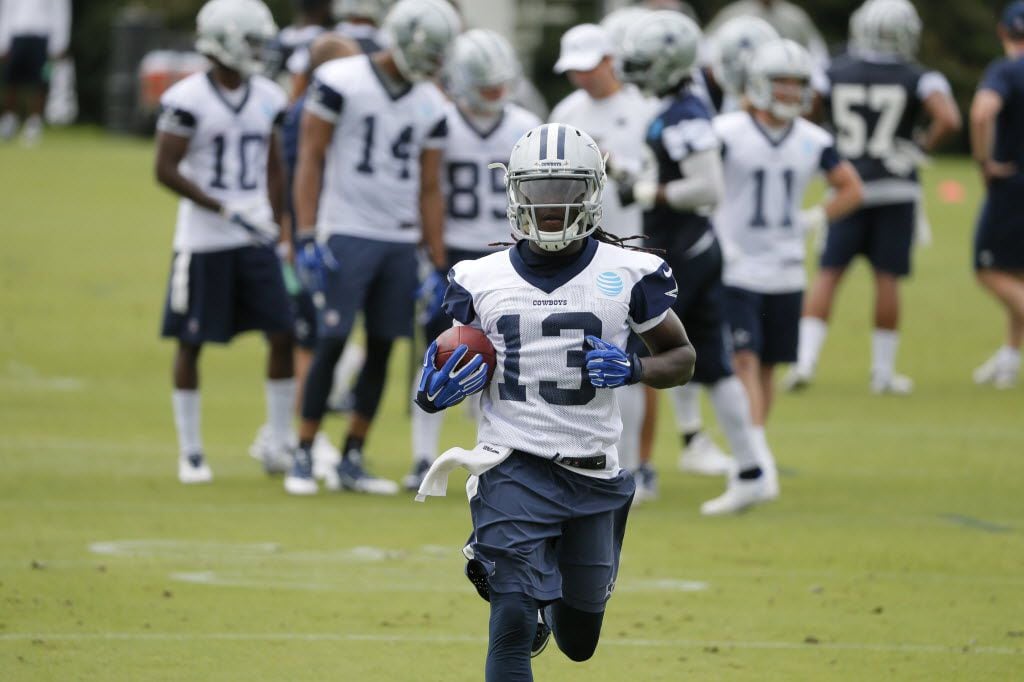 Dallas Cowboys wide receiver Lucky Whitehead (13) runs the ball after making a catch during...