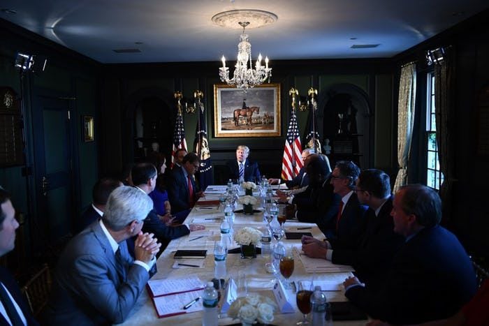 President Donald Trump participates in a roundtable discussion on prison reform, August 9,...