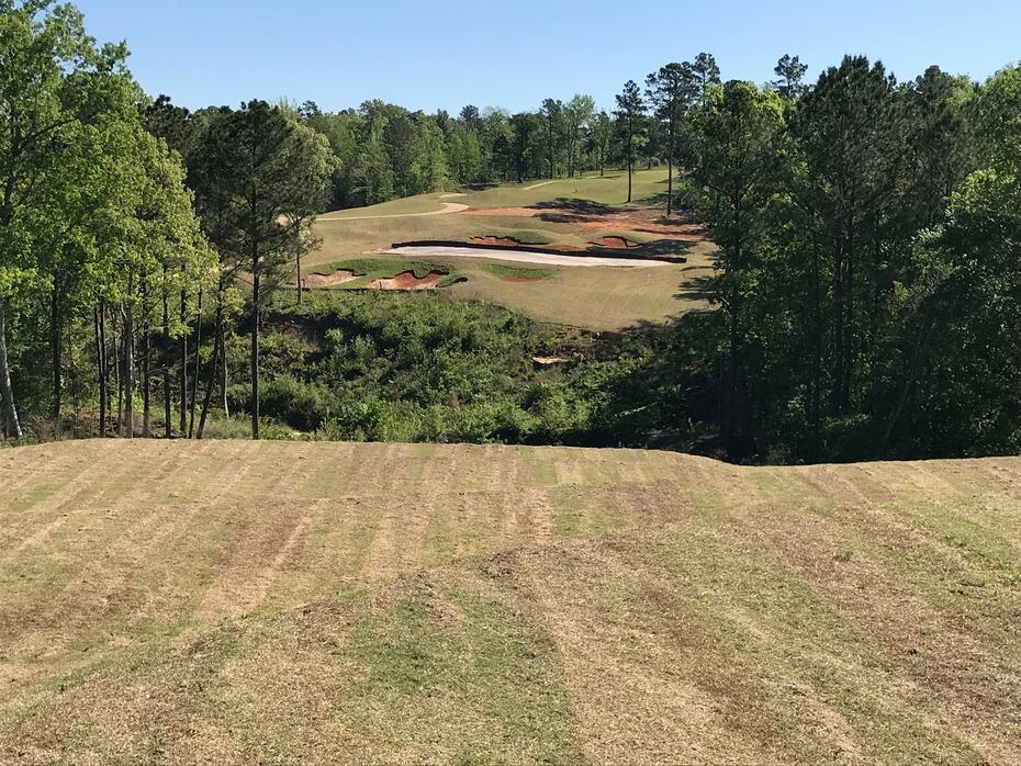 The dramatic par-3 12th hole at Tempest Golf Club in Gladewater, Texas, requires a shot over...