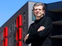 Architect Ron Stelmarksi stands in front of the Galbraith apartments, one of his projects,...