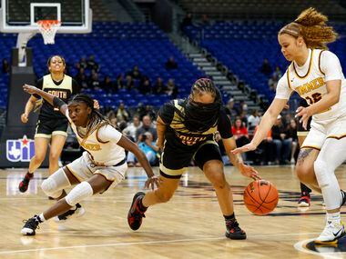 South Grand Prairie guard Victoria Dixon (10) reaches for a loose ball in front of Humble...