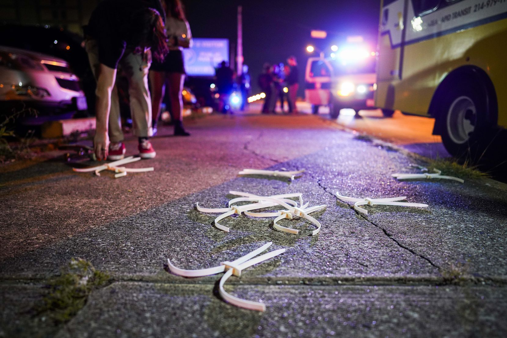 Disposable cuffs litter the sidewalk as protesters are released outside the Frank Crowley...