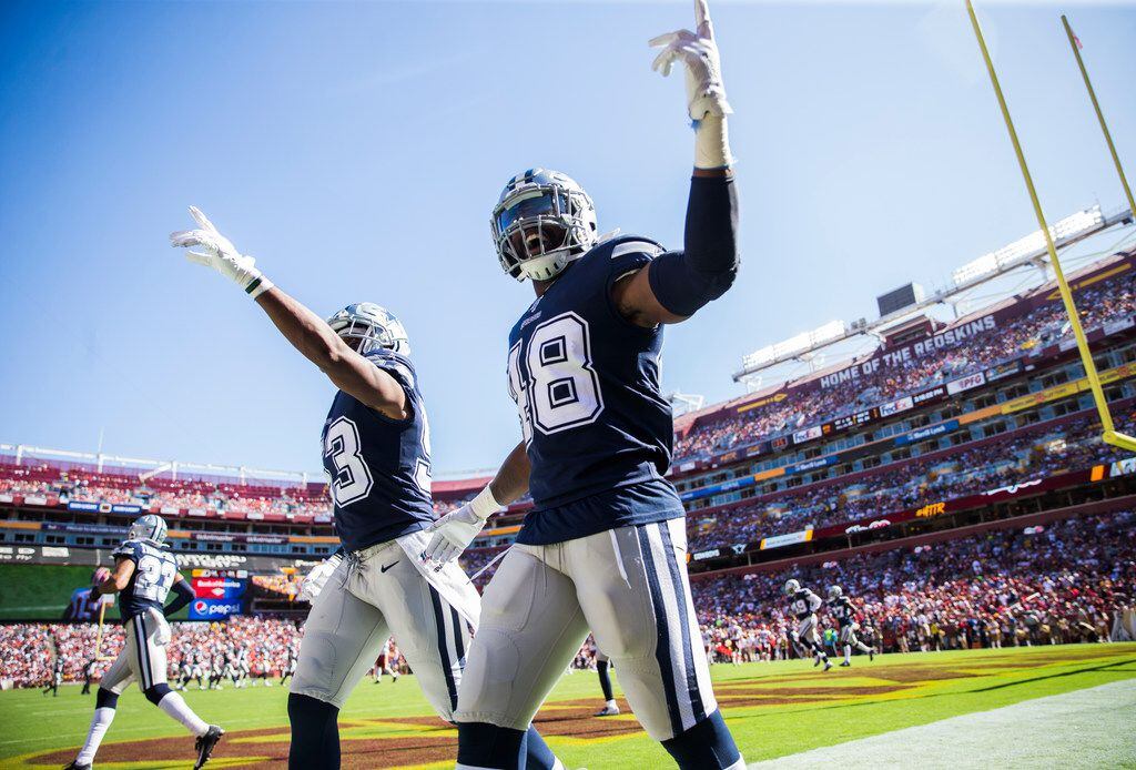 Dallas Cowboys defensive tackle Daniel Ross (93) and linebacker Joe Thomas (48) try to hype up fans in the end zone during the fourth quarter of an NFL game between the Dallas Cowboys and the Washington Redskins on Sunday, September 15, 2019 at FedExField in Landover, Maryland.