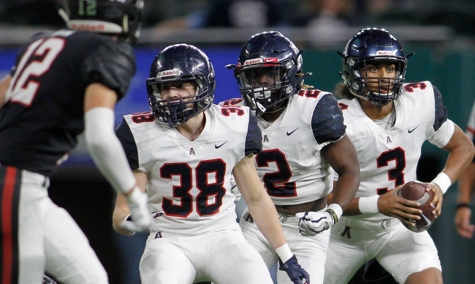 Allen quarterback Mike Hawkins (3), right, rolls out behind the protection of Eagles running...