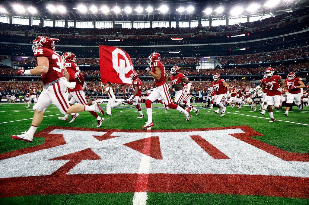 The Boomer Schooner leads the Oklahoma Sooners football team onto the field to face the TCU...