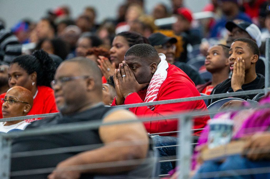 Cedar Hill fans react in shock after Denton Guyer recovers a fumble during the second half...