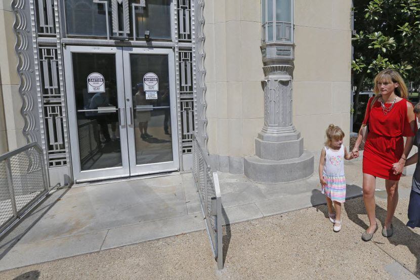 Amber Briggle of Denton and her children, Lulu, 4, and transgender son MG, 8, attended a...