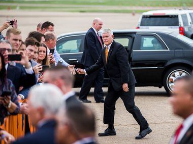 U.S. Representative Pete Sessions returns a pen to a supporter after he and Vice President...
