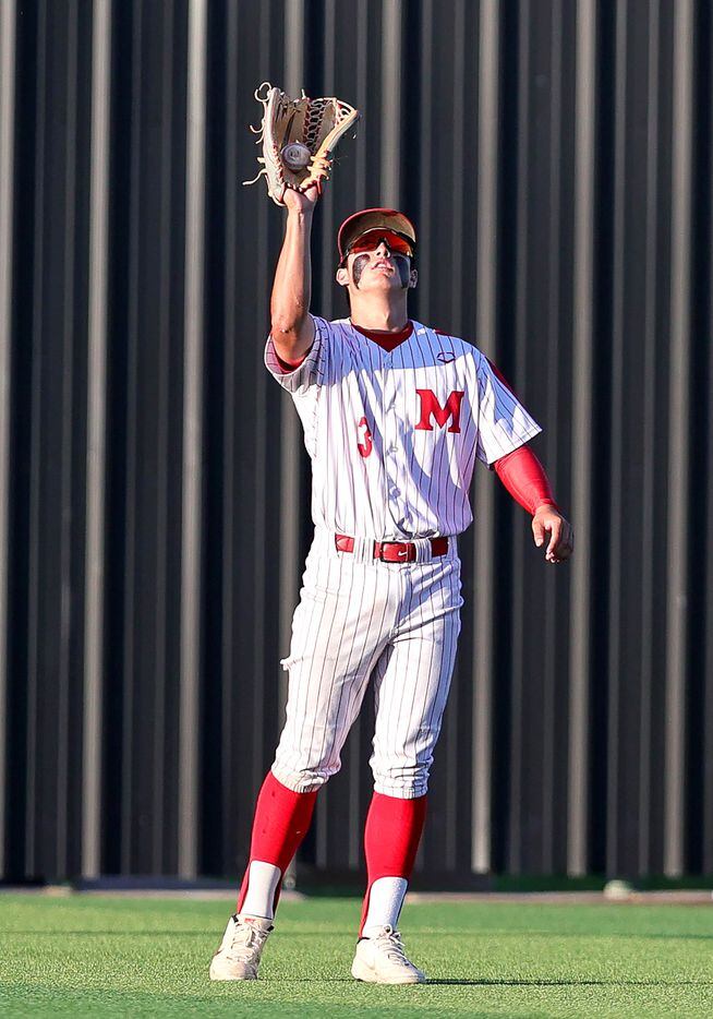 Flower Mound Marcus center fielder Jake Duer comes up with a catch against Keller during...