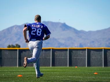 Texas Rangers pitcher Corey Kluber runs on a conditioning field during a spring training workout at the team's training facility on Friday, Feb. 14, 2020, in Surprise, Ariz. 