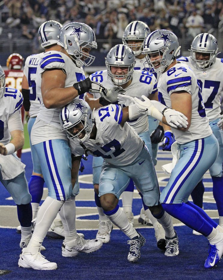 Dallas Cowboys wide receiver Malik Turner (17) celebrates with teammates, after scoring a...
