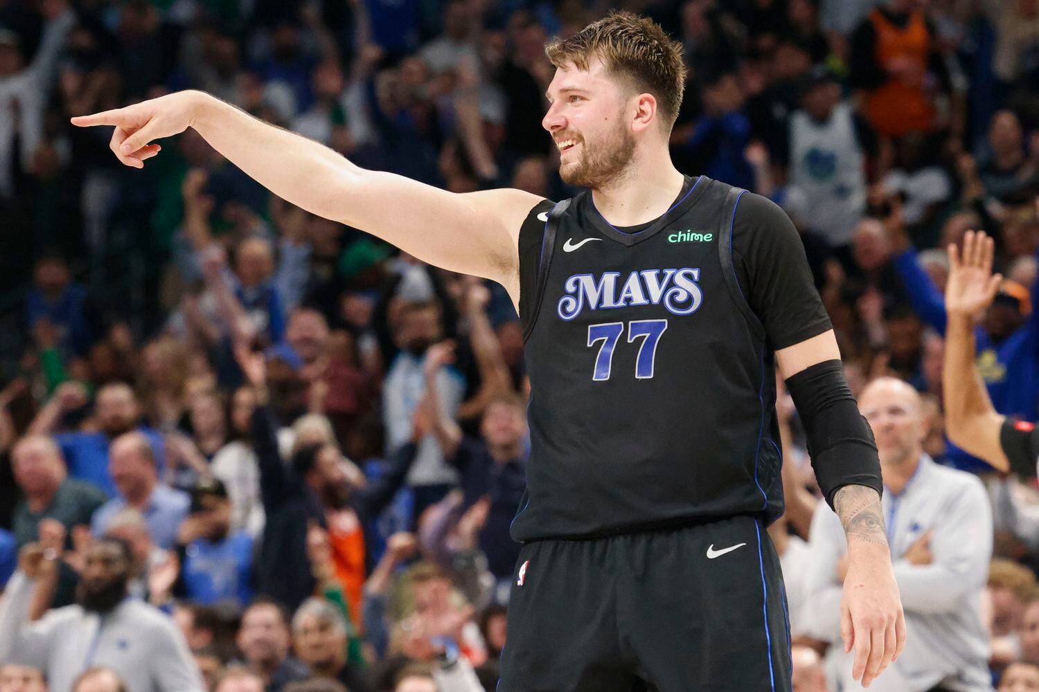 Dallas Mavericks guard Luka Doncic reacts after a point against the Phoenix Suns during the...
