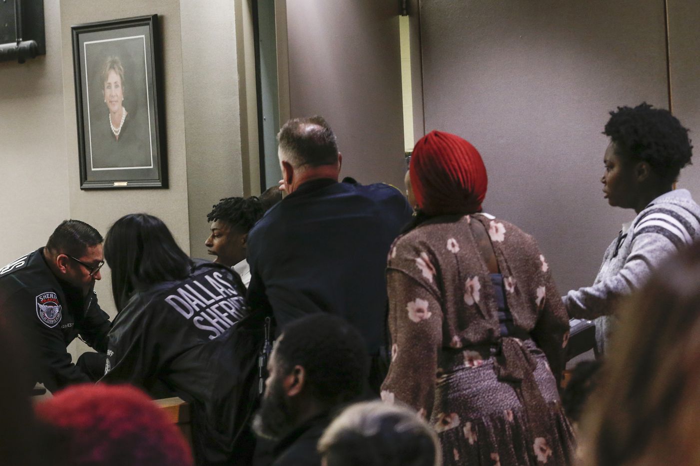 Desmond Jones, one of the men implicated in the kidnapping and death of 13-year-old Shavon Randle, is carried from the courtroom by officers after he had an outburst during the punishment phase of his trial. Jones was found guilty of engaging in organized criminal activity. (Ryan Michalesko/The Dallas Morning News)