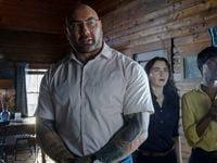Dave Bautista (from left), Abby Quinn and Nikki Amuka-Bird play brutal invaders at a...