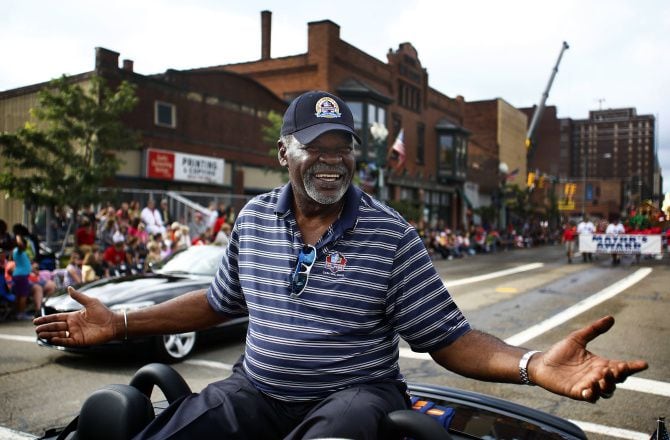 Dallas Cowboys Hall of Famer Rayfield Wright waves to fans along Cleveland Ave during the...
