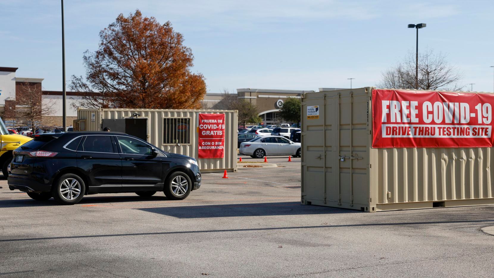 A car waits in line at a COVID-19 testing location in Richardson, Texas, on Dec. 24, 2021.