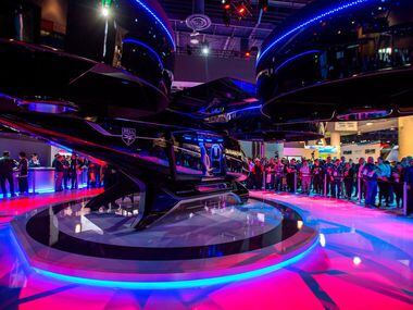 Conference attendees at CES, an annual trade show organized by the Consumer Technology...