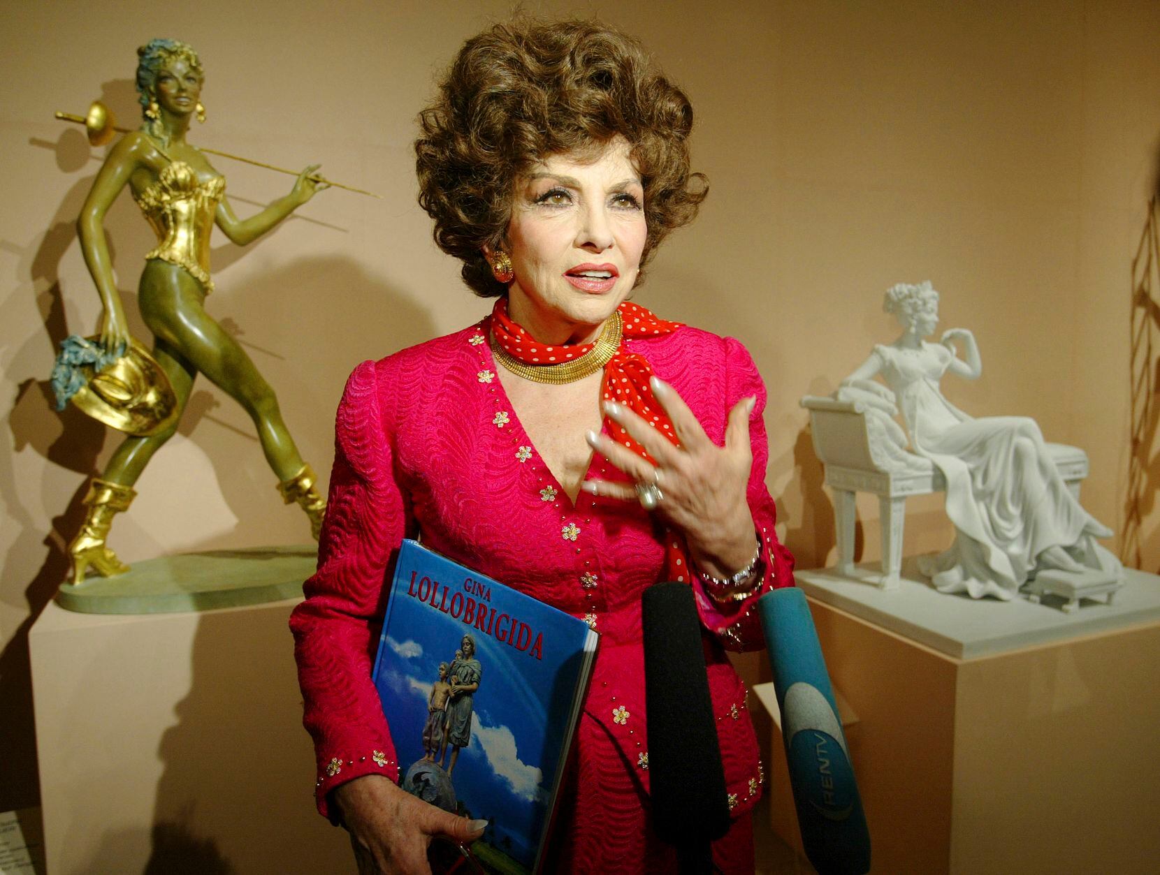 File - Italian actress Gina Lollobrigida speaks at the media viewing of the first exhibition.