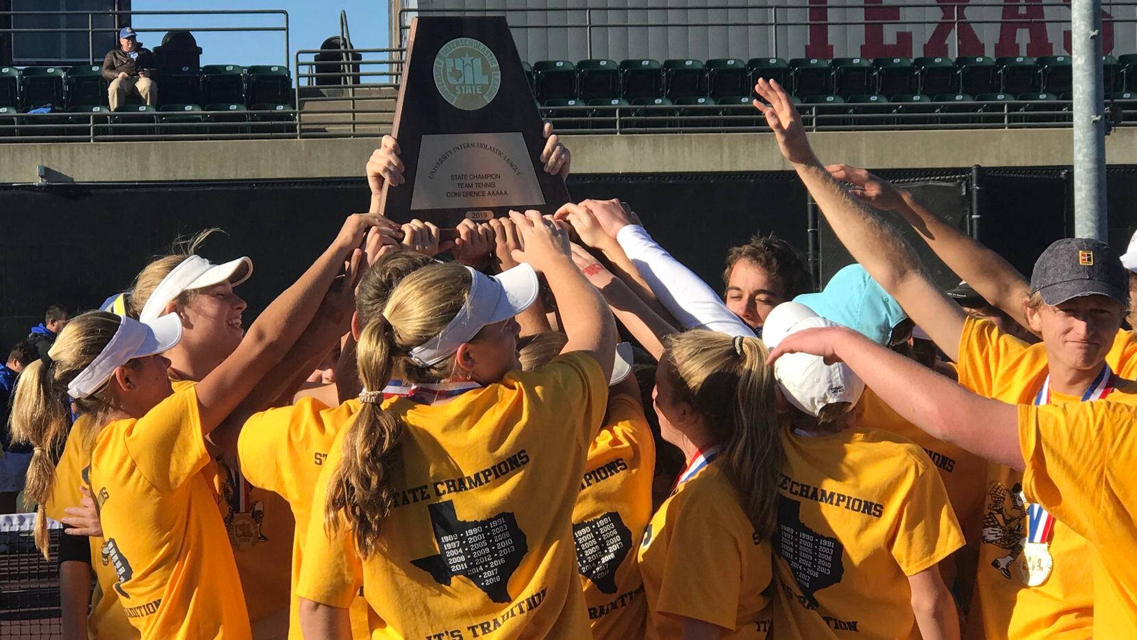 Highland Park celebrates winning the Class 5A state championship in team tennis on Oct. 31,...