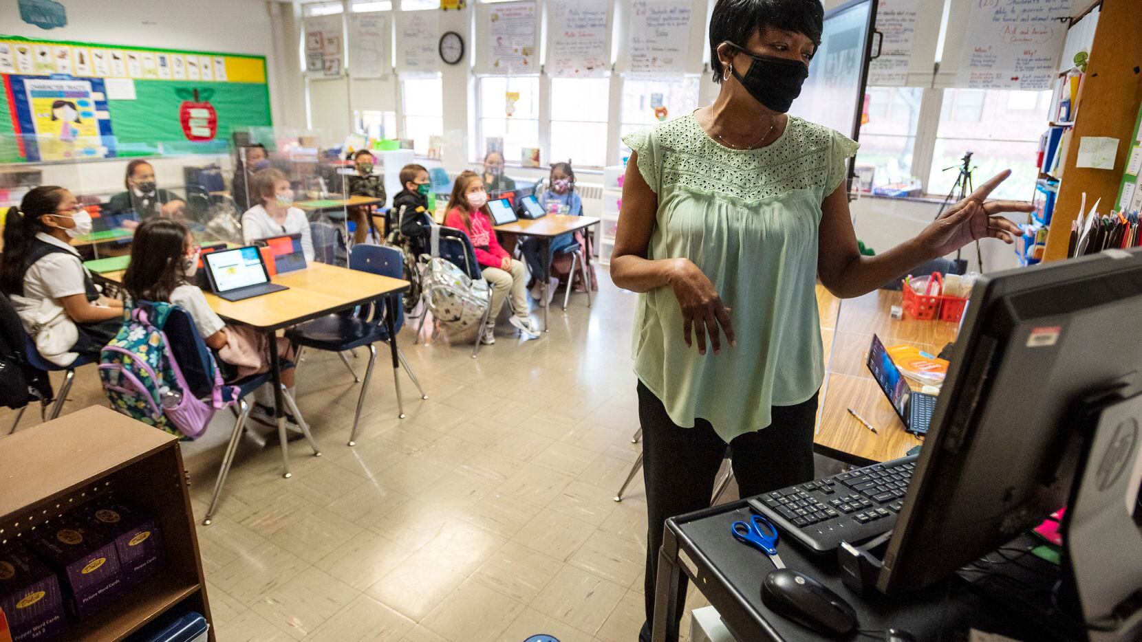 Second-grade teacher Michelle Jones conducts a lesson in her classroom at Tom Gooch...
