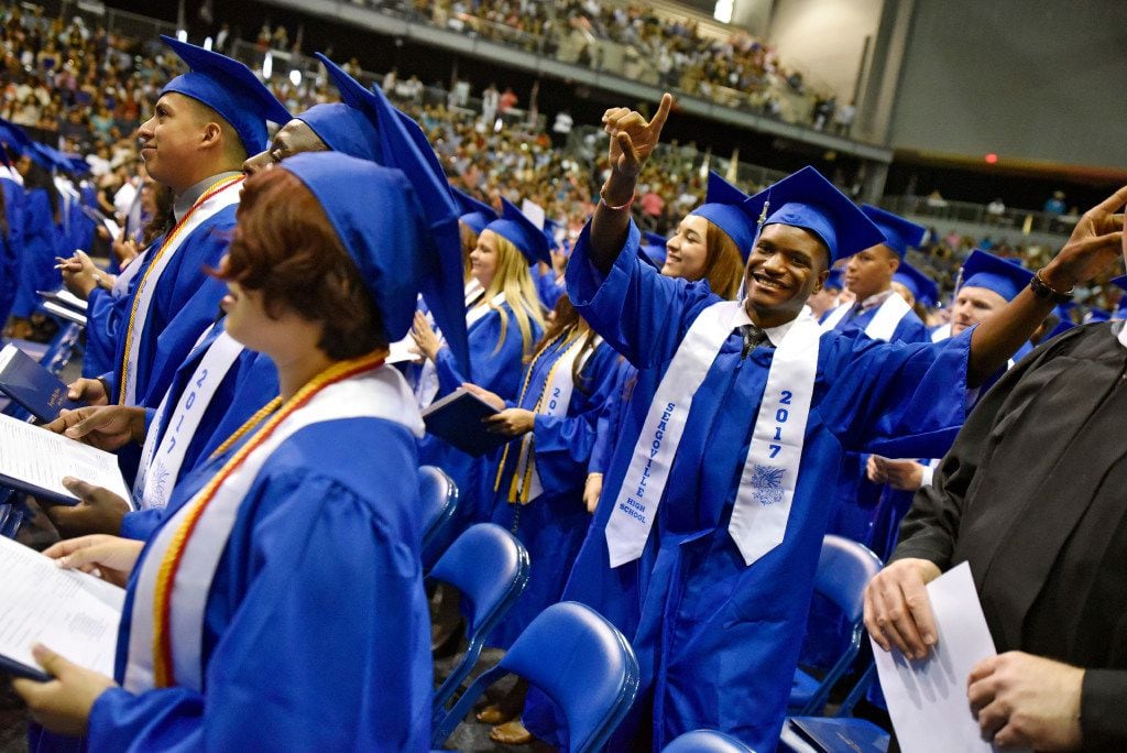 Isaiah Cherry dances as the a graduation ceremony comes to an end for Seagoville High School...