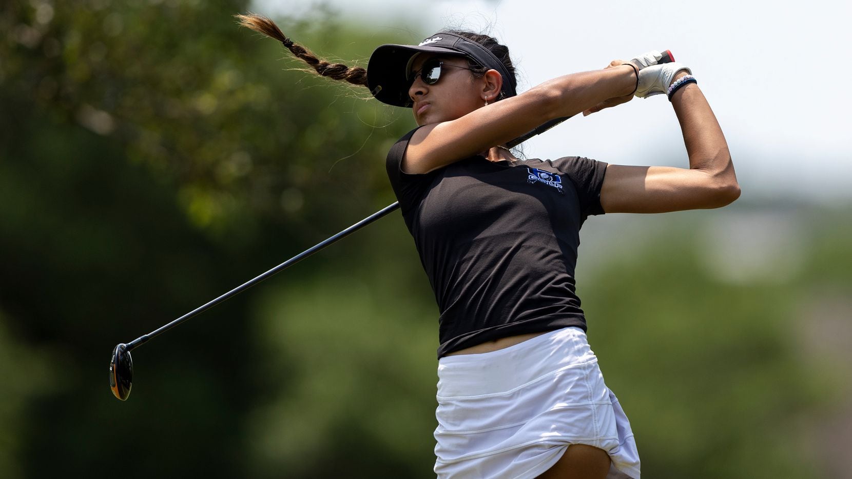 Hebron’s Symran Shah hits from the 9th tee box during the 6A girls state golf tournament in...