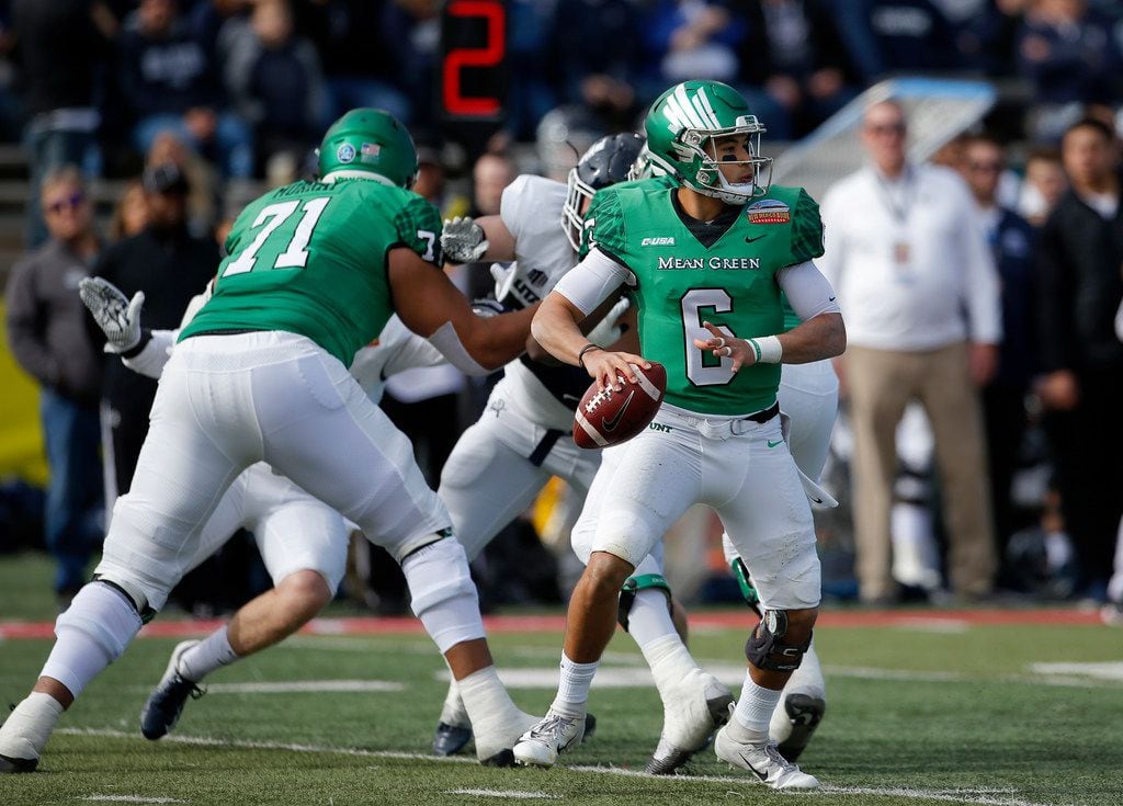 North Texas quarterback Mason Fine (6) looks to throw a pass during the first half of the...