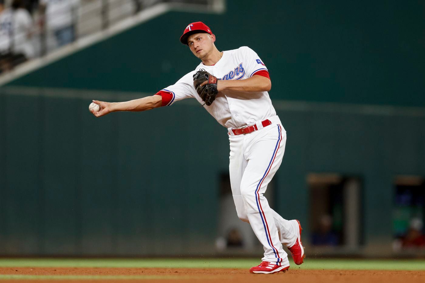 Texas Rangers shortstop Corey Seager (5) turns a double play during the seventh inning of a...