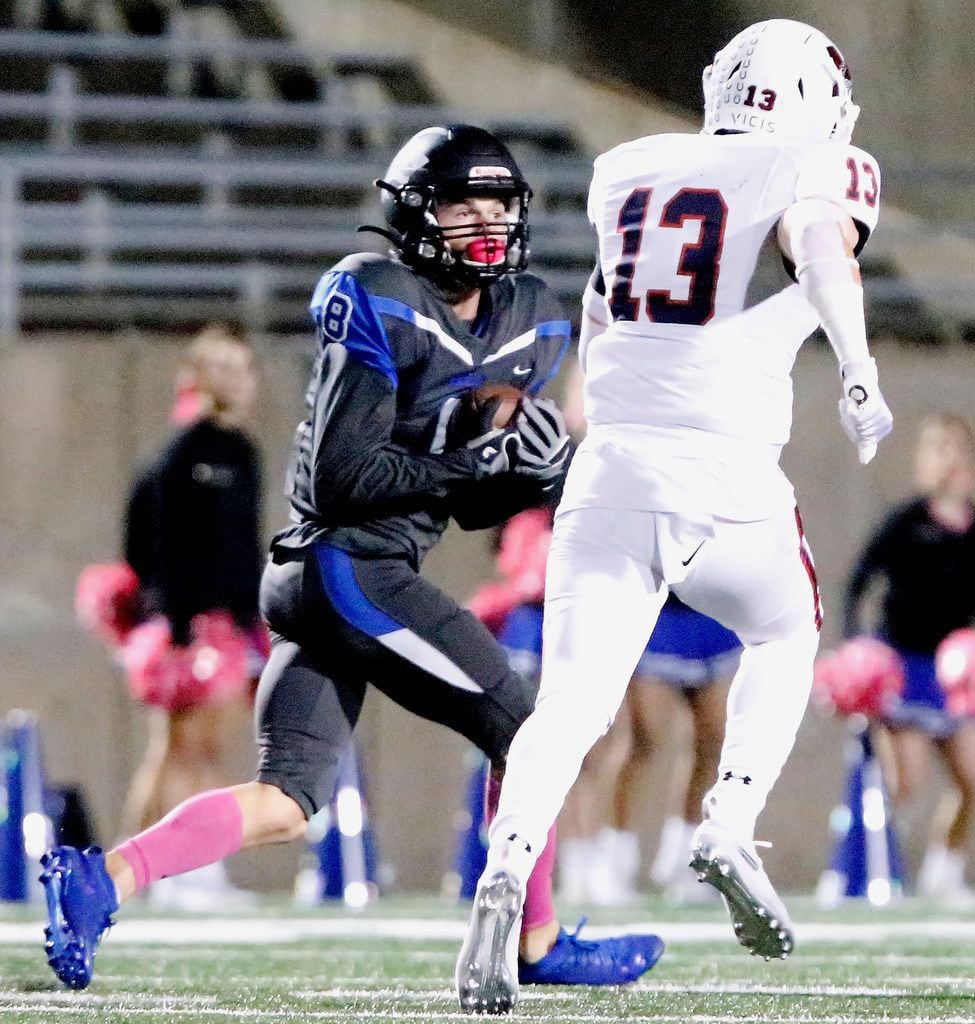 Plano West High School wide receiver Cole Carter (8) catches a pass behind McKinney Boyd...