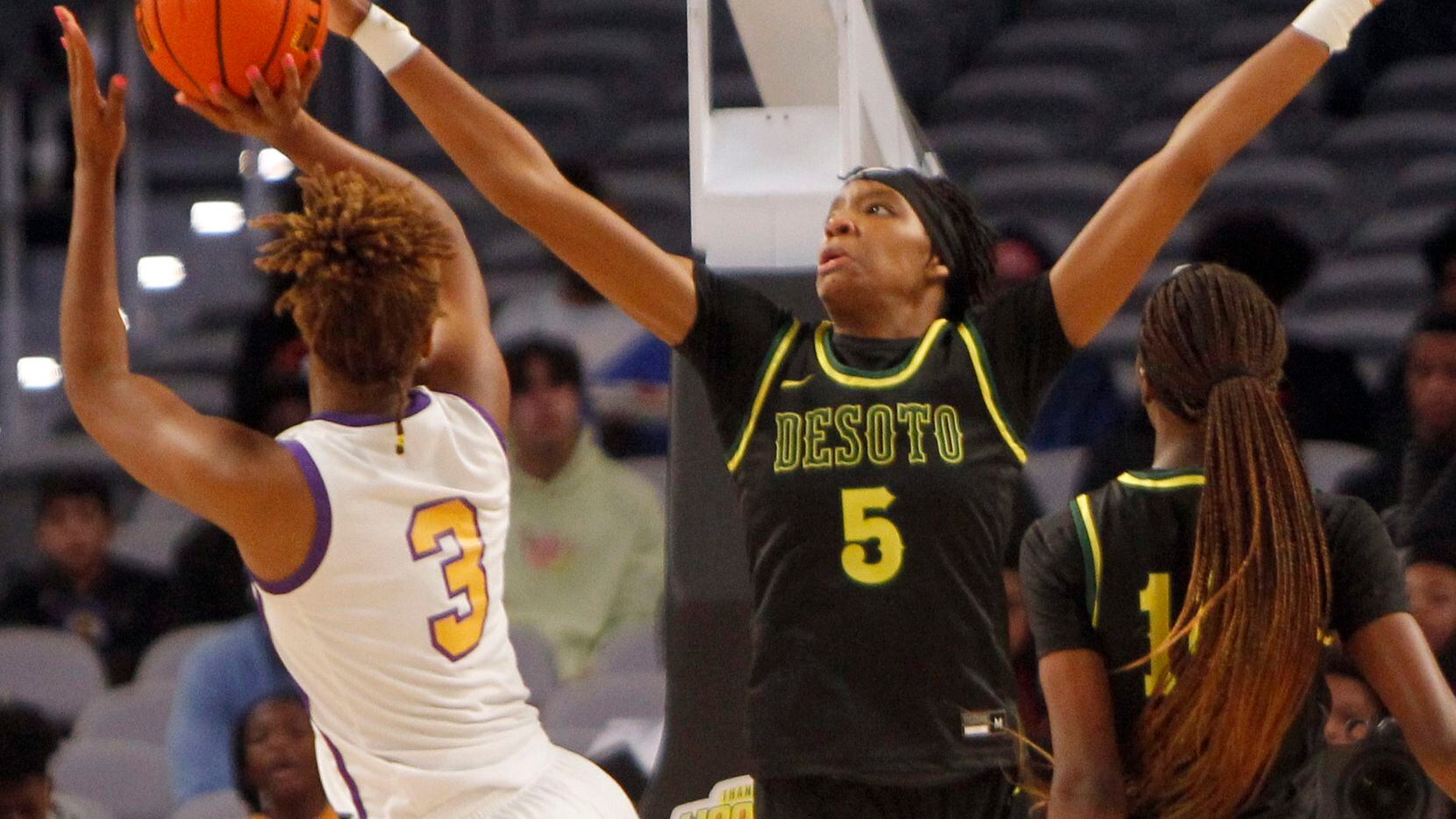DeSoto senior Sa' Myah  Smith (5) defends a shot by Montverde forward Janiah Barker (3) during first half action. The two teams played their basketball game as part of the Thanksgiving Hoopfest which was held at Dickies Arena In Fort Worth on November 27, 2021. (Steve Hamm/ Special Contributor)