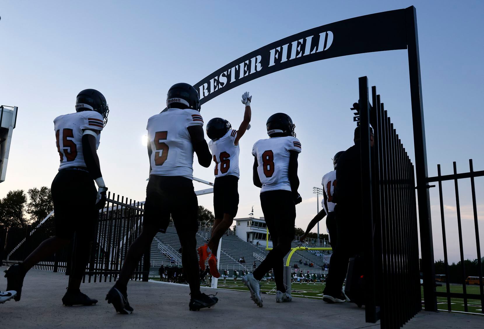 The W.T. White football team enters Forester Field to face Bryan Adams in Dallas, October 6,...