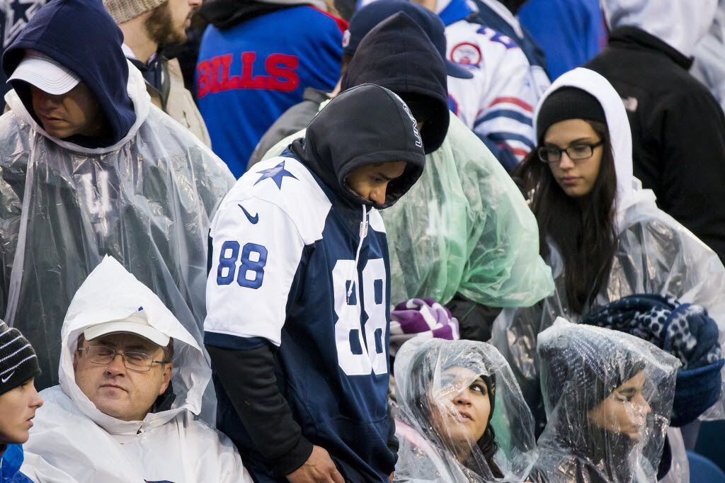 Dallas Cowboys fans react after a Cowboys turnover during the second half of an NFL football...