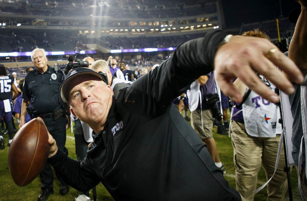 TCU head coach Gary Patterson tosses a football into the stands following a victory over Texas in an NCAA football game at Amon G. Carter Stadium on Saturday, Nov. 4, 2017, in Fort Worth, Texas. TCU won the game 24-7. (Smiley N. Pool/The Dallas Morning News)