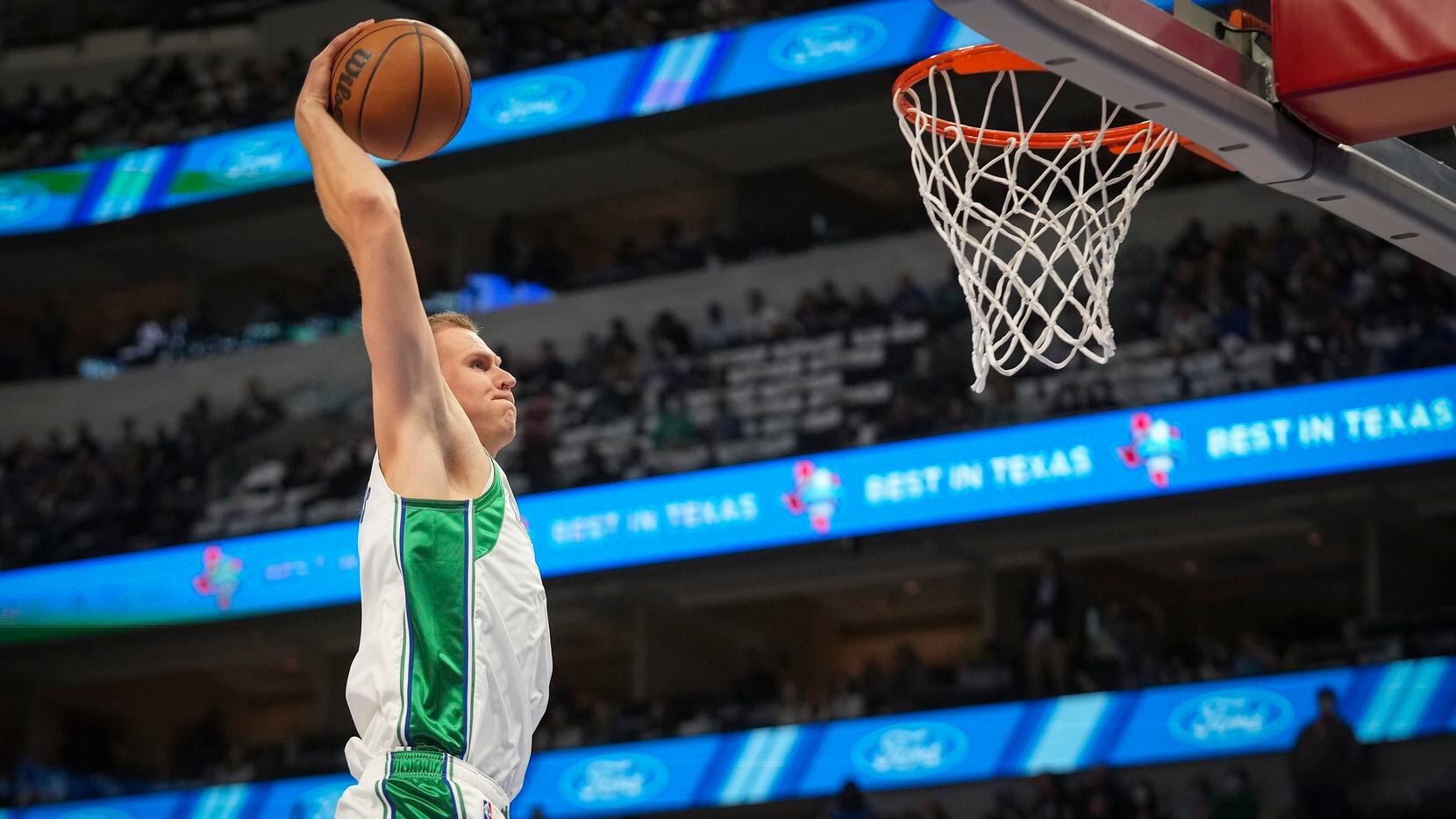 Dallas Mavericks center Kristaps Porzingis (6) dunks during the first half of an NBA basketball game against the Boston Celtics at American Airlines Center on Saturday, Nov. 6, 2021, in Dallas.