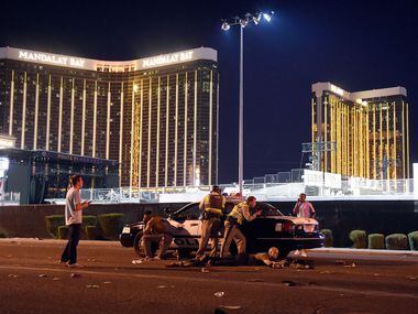 Las Vegas police stand guard along the streets outside the festival grounds of the Route 91...
