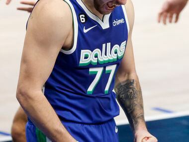 Dallas Mavericks guard Luka Doncic (77) reacts after making a shot while being fouled during...