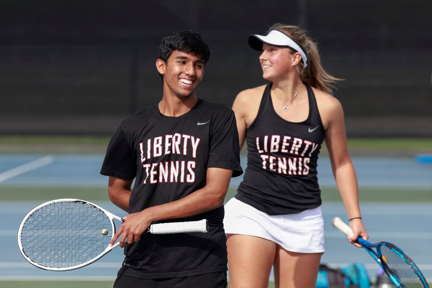 Frisco Liberty’s Sanjheev Rao (left) celebrates with teammate Milla Dopson during the 5A...
