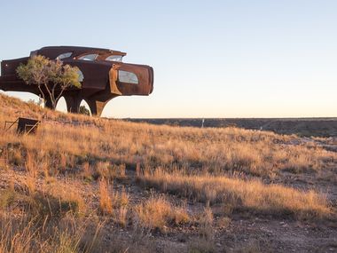 The sun sets on Robert Bruno's Steel House in Ransom Canyon, a residential community east of Lubbock, Texas.