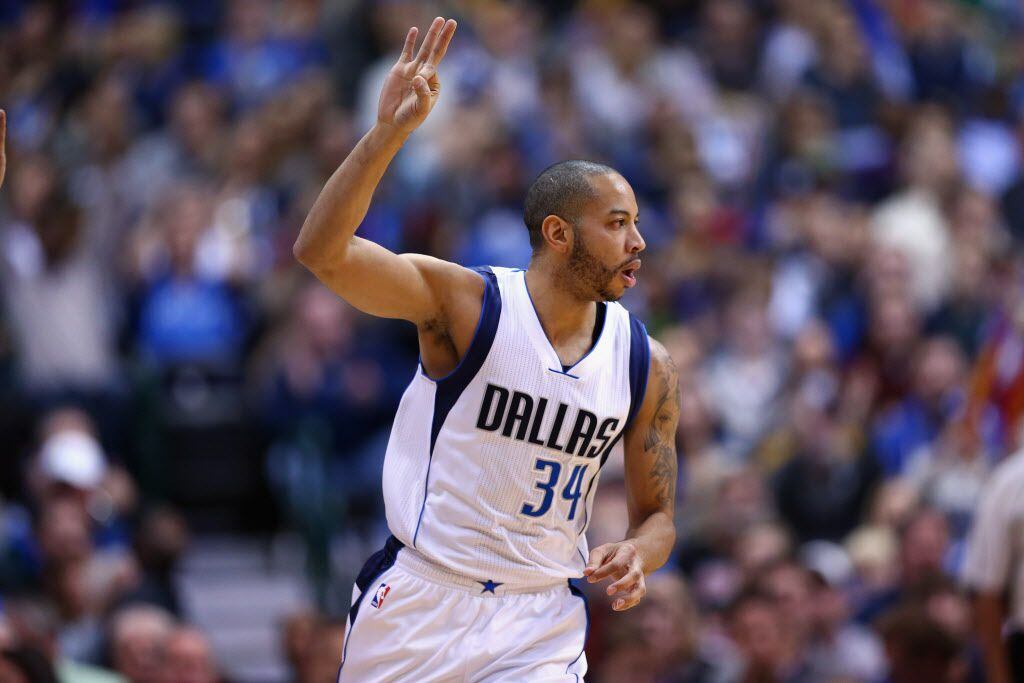 Devin Harris #34 of the Dallas Mavericks reacts after a three-point shot against the Dallas...